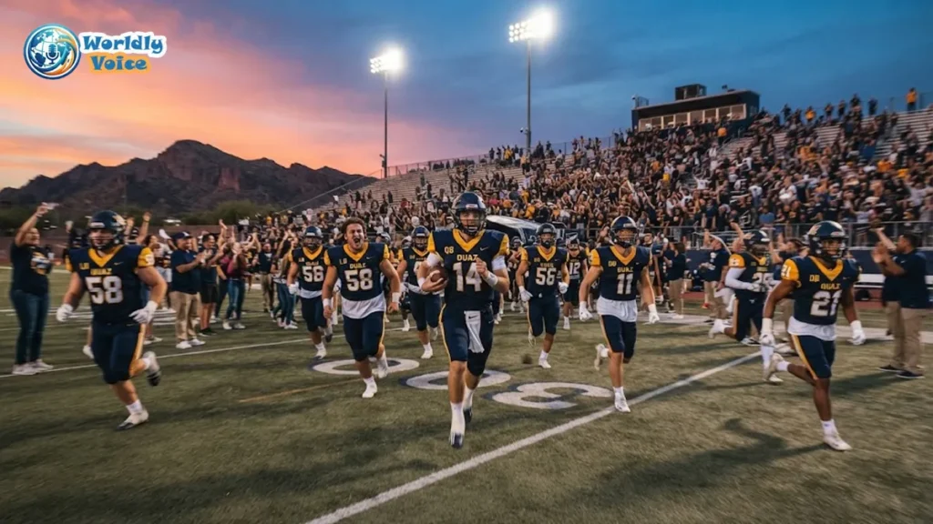 OUAZ football players running onto the field under stadium lights during a 2025 NAIA college football game in Arizona